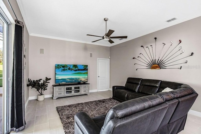 living room with visible vents, baseboards, crown molding, and ceiling fan