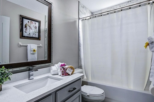 full bath with toilet, shower / bath combo, and vanity