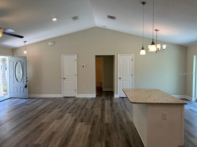 120 S Chandler Ave, Deland, FL 32724 - kitchen featuring vaulted ceiling, ceiling fan, dark wood-style flooring, baseboards, and hanging light fixtures