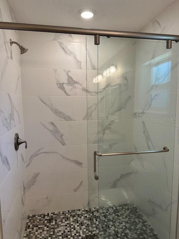 120 S Chandler Ave, Deland, FL 32724 - bathroom with a shower stall and recessed lighting
