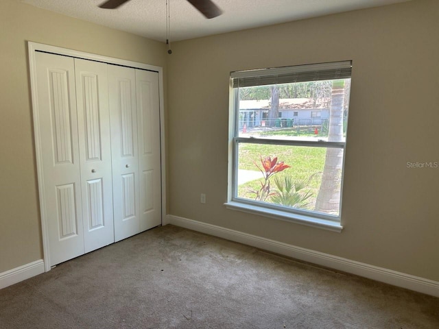 120 S Chandler Ave, Deland, FL 32724 - unfurnished bedroom featuring carpet floors, multiple windows, and baseboards