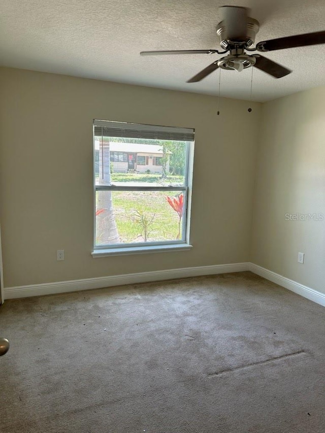 120 S Chandler Ave, Deland, FL 32724 - carpeted spare room featuring a ceiling fan, a textured ceiling, and baseboards