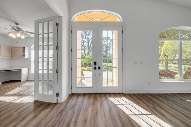 entryway featuring ceiling fan, french doors, baseboards, and wood finished floors