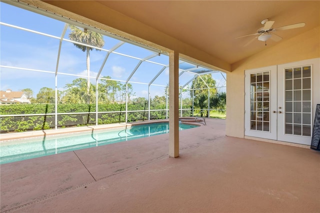 outdoor pool with a ceiling fan, a patio, french doors, and a lanai