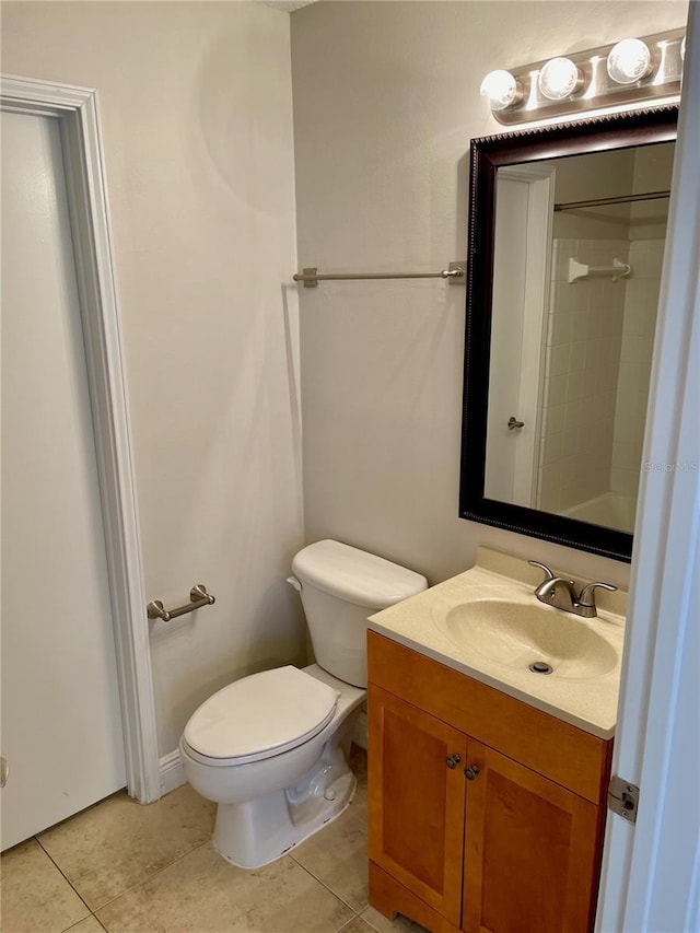 full bathroom featuring tile patterned flooring, toilet, vanity, and walk in shower