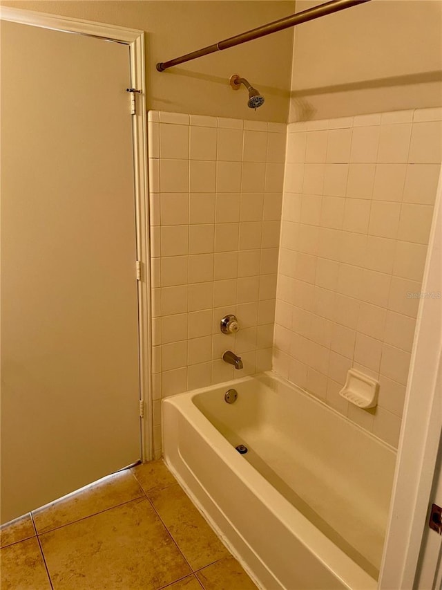 bathroom featuring tile patterned floors and bathtub / shower combination