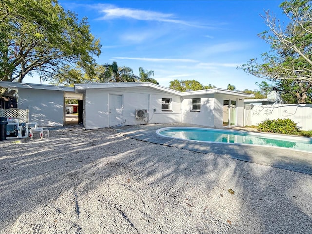 back of house featuring a fenced in pool, a patio, and fence