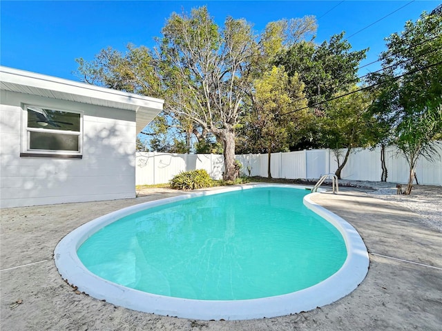 view of swimming pool with a fenced in pool and a fenced backyard