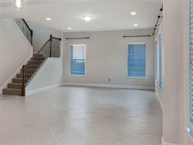 interior space with recessed lighting, stairs, and baseboards