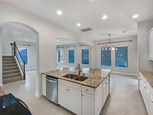 kitchen featuring dishwasher, recessed lighting, white cabinetry, and a sink