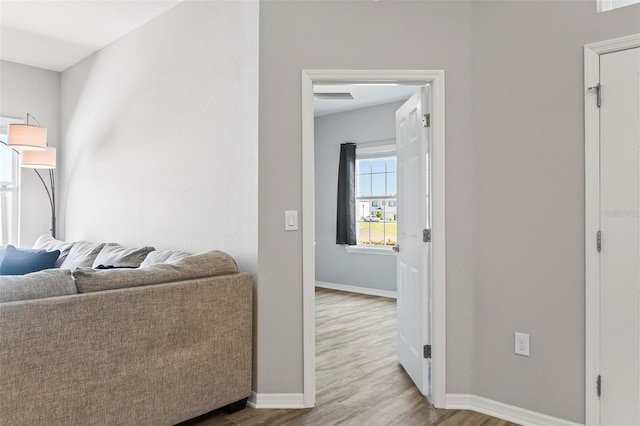 living room with wood finished floors and baseboards