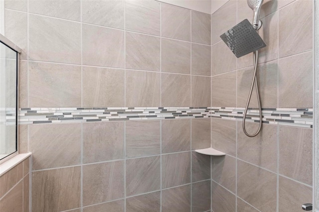 full bathroom with tiled shower