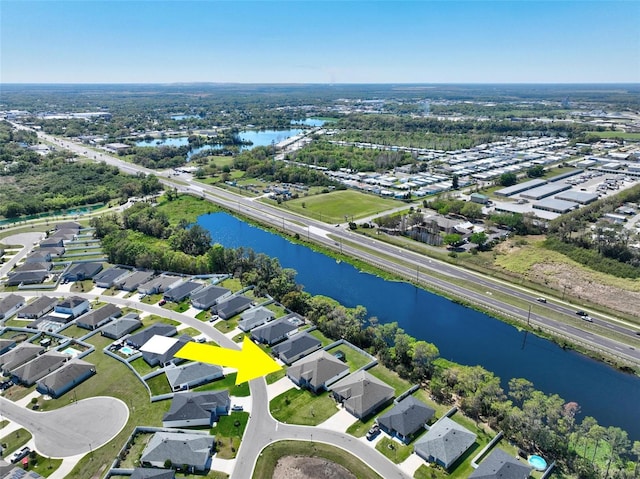 birds eye view of property with a residential view and a water view