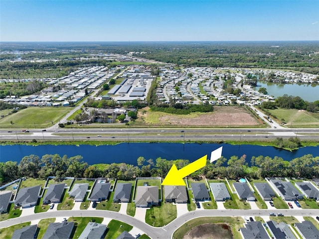 aerial view with a water view and a residential view