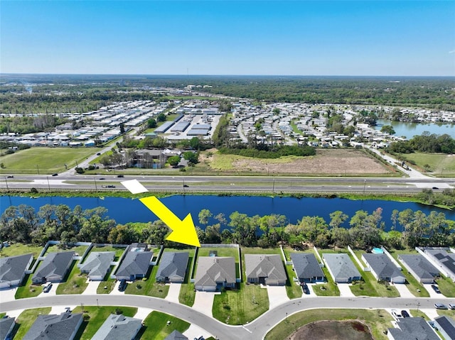 aerial view featuring a residential view and a water view