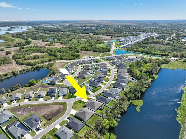 aerial view with a residential view and a water view