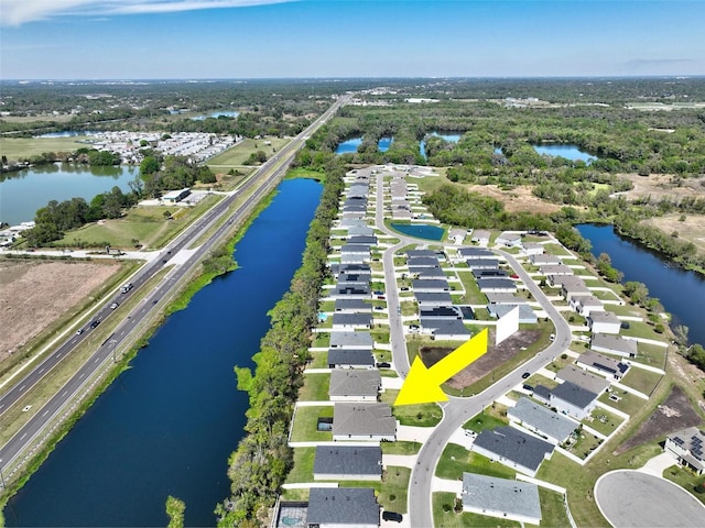 birds eye view of property featuring a water view