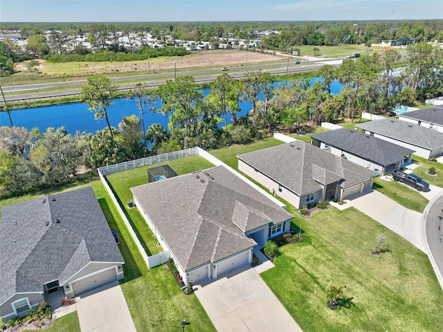 birds eye view of property with a residential view and a water view