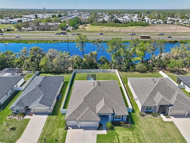 bird's eye view with a residential view and a water view