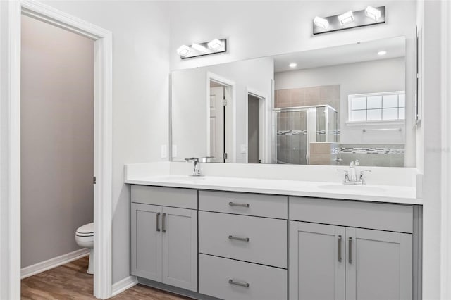 149 St Thomas Dr, Mulberry, FL 33860 - full bath featuring a shower stall, double vanity, and wood finished floors