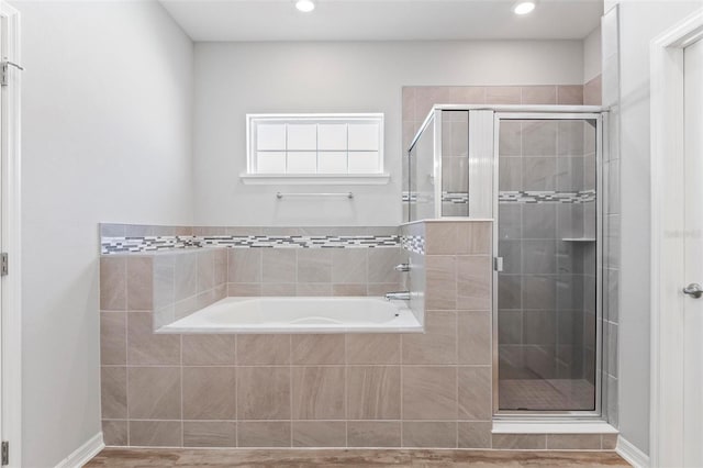 149 St Thomas Dr, Mulberry, FL 33860 - full bathroom with a garden tub, a stall shower, and recessed lighting