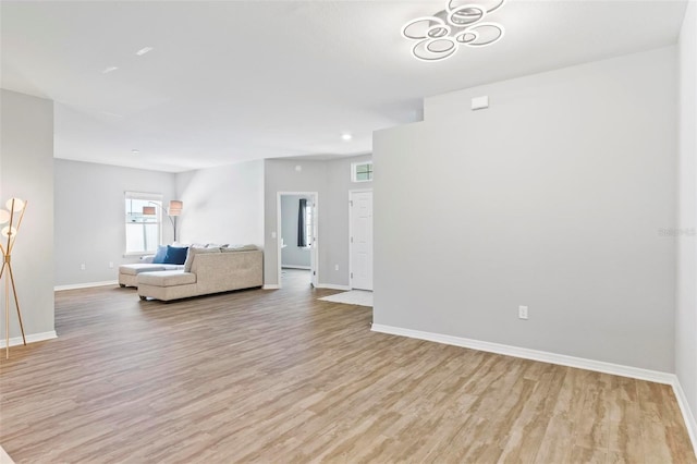 149 St Thomas Dr, Mulberry, FL 33860 - living room featuring light wood-style flooring and baseboards