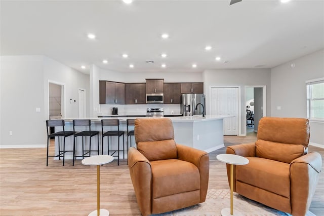149 St Thomas Dr, Mulberry, FL 33860 - living room featuring light wood-style flooring and recessed lighting