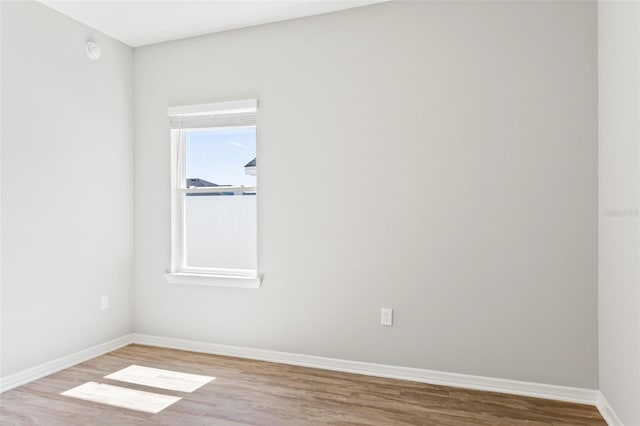 149 St Thomas Dr, Mulberry, FL 33860 - empty room with wood finished floors and a smoke detector