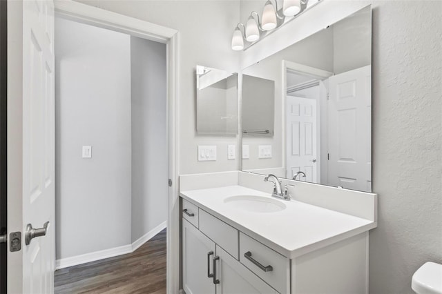 149 St Thomas Dr, Mulberry, FL 33860 - half bath featuring vanity, wood finished floors, and a textured wall