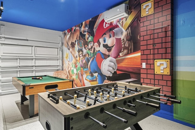 game room with speckled floor, billiards, and a wall mounted AC