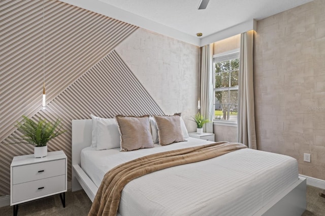 bedroom featuring a ceiling fan and carpet