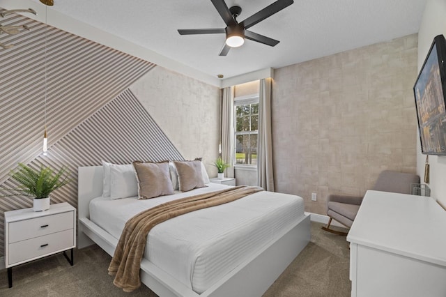 carpeted bedroom with wallpapered walls and a ceiling fan