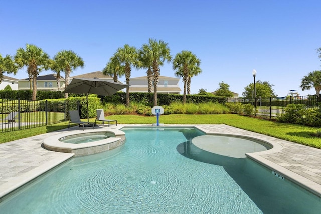 view of swimming pool with a yard, a fenced backyard, and a pool with connected hot tub