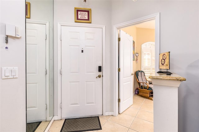 foyer featuring light tile patterned floors