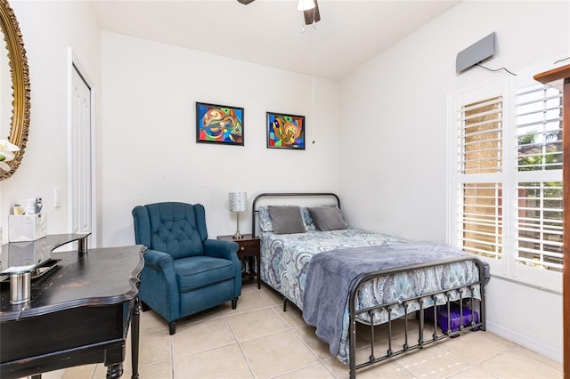 bedroom with light tile patterned flooring and a ceiling fan