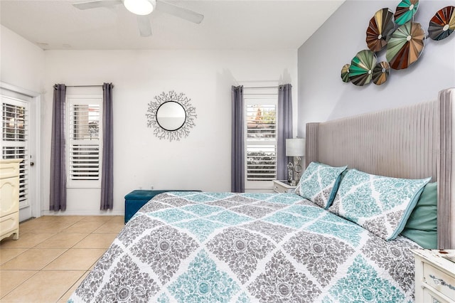 bedroom with light tile patterned floors and ceiling fan