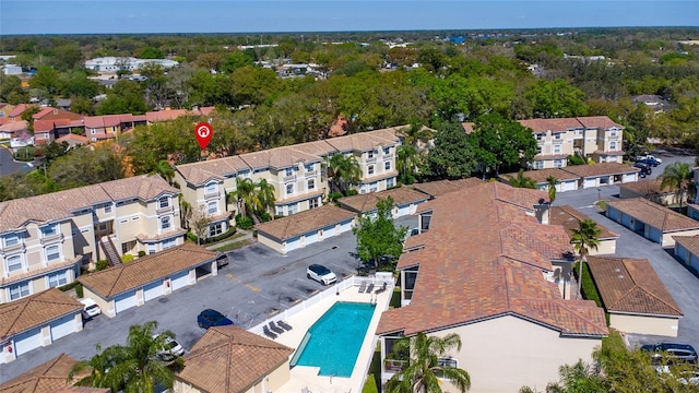 birds eye view of property with a residential view