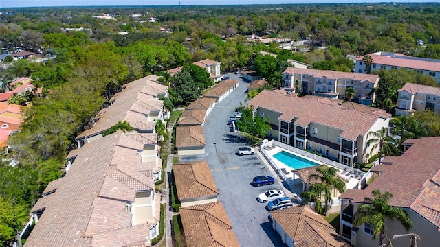 aerial view featuring a residential view and a forest view