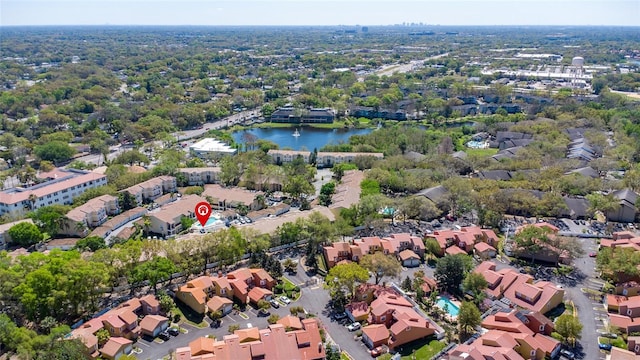 drone / aerial view featuring a residential view and a water view