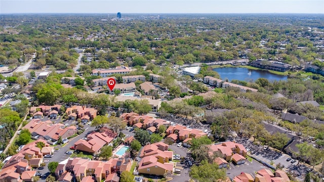 birds eye view of property with a residential view and a water view