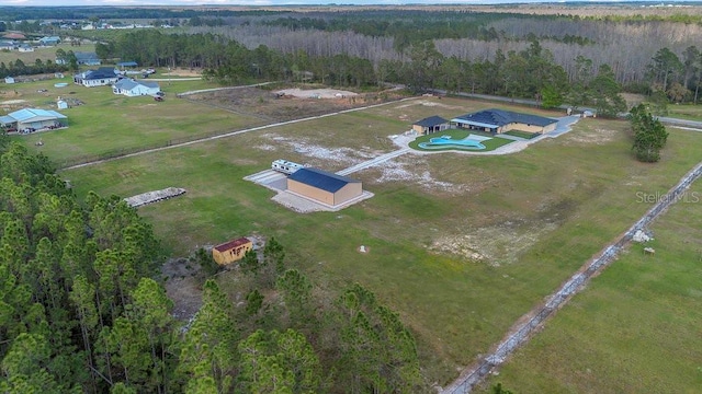 bird's eye view featuring a forest view