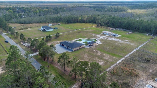 bird's eye view featuring a rural view and a wooded view