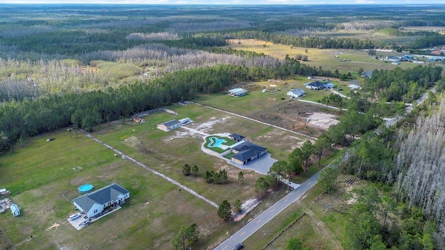 bird's eye view featuring a rural view and a forest view