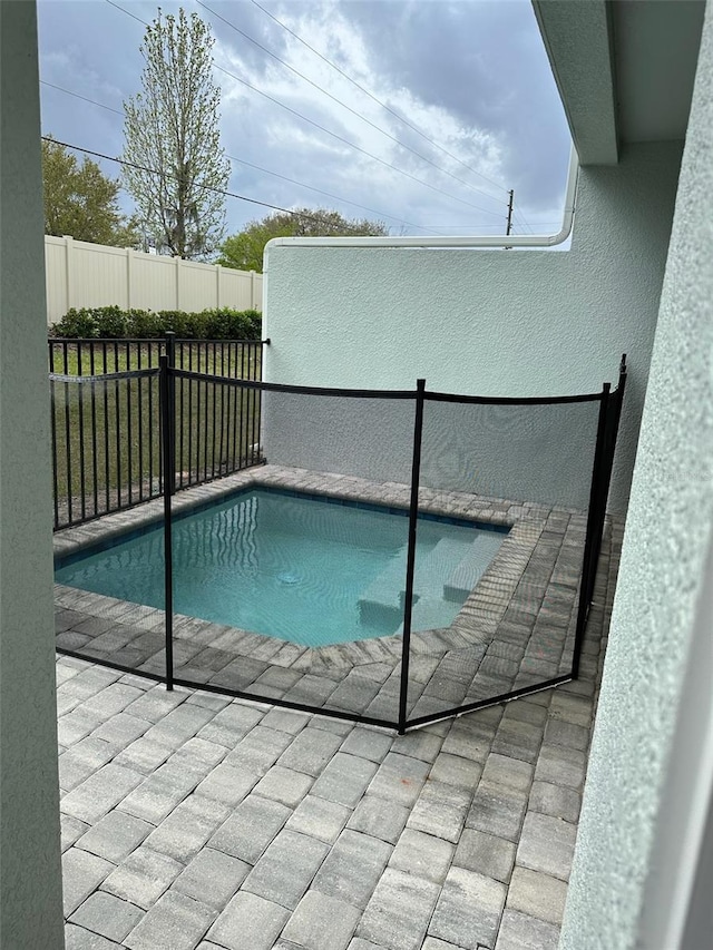 view of pool featuring a fenced in pool and fence