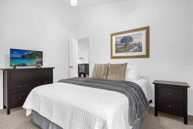 bedroom featuring light colored carpet and baseboards