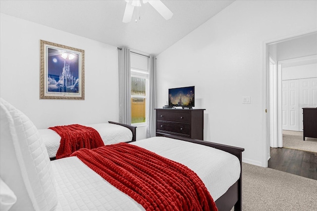 bedroom with ceiling fan, baseboards, lofted ceiling, and carpet floors