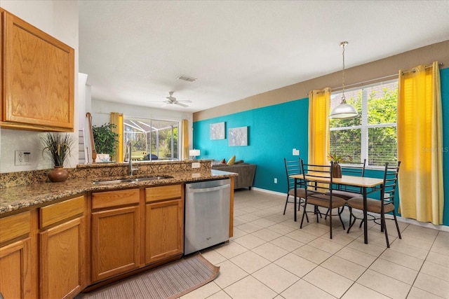 229 Troon Cir, Davenport, FL 33897 - kitchen featuring stainless steel dishwasher, a peninsula, healthy amount of natural light, and a ceiling fan