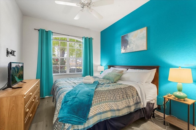 229 Troon Cir, Davenport, FL 33897 - bedroom with wood finished floors and a ceiling fan