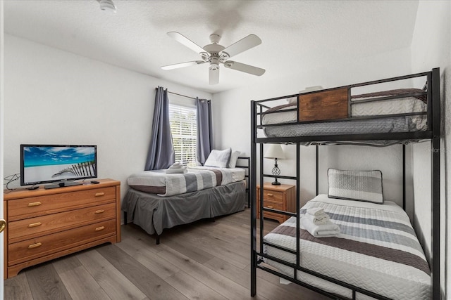 229 Troon Cir, Davenport, FL 33897 - bedroom featuring wood finished floors and a ceiling fan