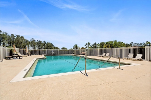 229 Troon Cir, Davenport, FL 33897 - community pool with a patio